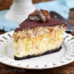 a slice of Almond Joy cheesecake on a white plate.