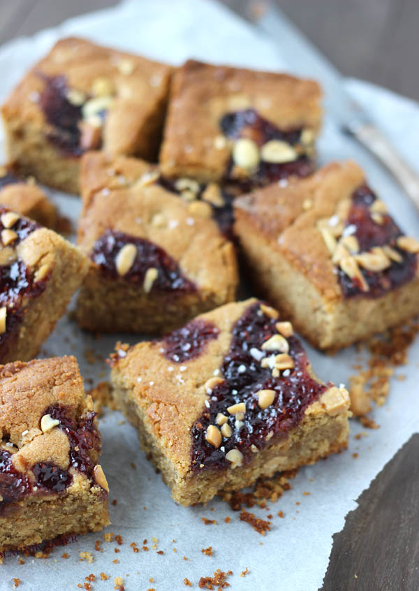 salted peanut butter and jelly blondies on a napkin 