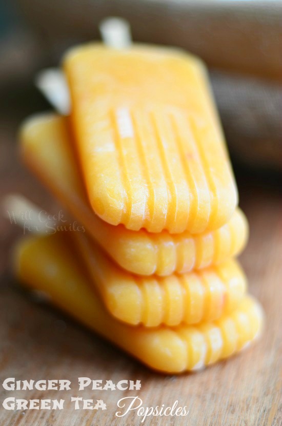 Ginger Peach Green Tea Popsicles on a cutting board 