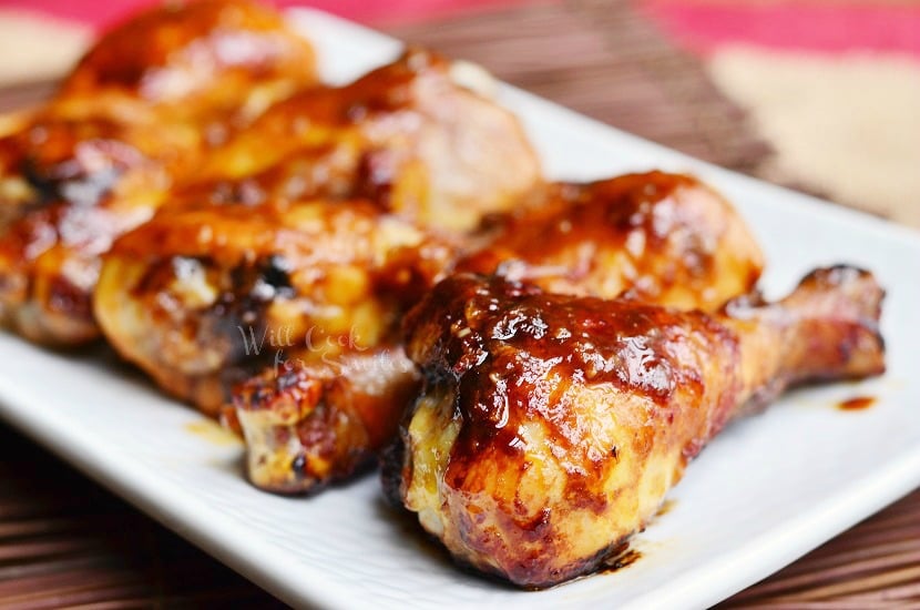 horizonal Asian Roasted Drumsticks on a white rectangular plate 