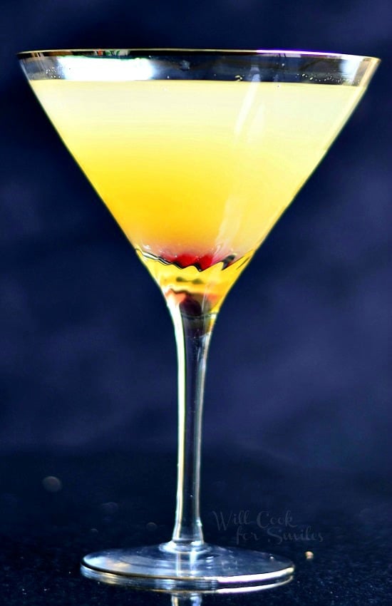 Pineapple Champagne Martini in a martini glass with a cherry in the bottom 