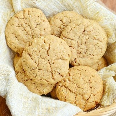 view from above of a basket filled with soft almond butter oatmeal cookies