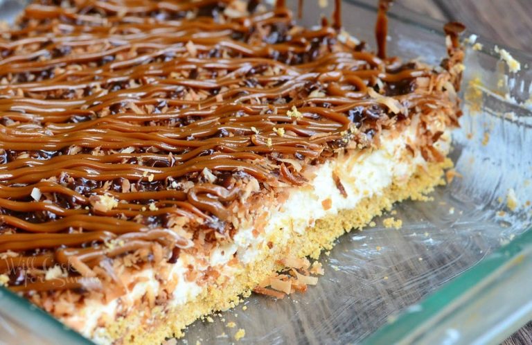 Glass baking dish filled with no bake samoas cheesecake bars