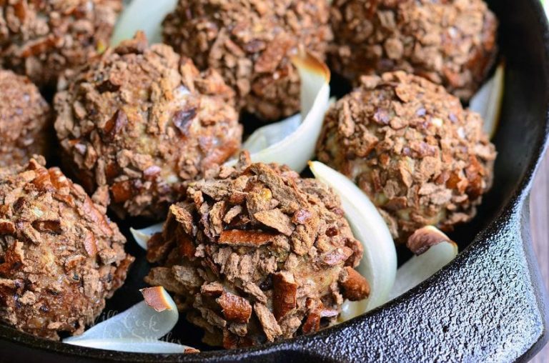 black skillet with pretzel crusted paresan turkey meatballs as viewed close up