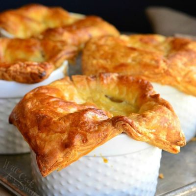 4 pot pies on a baking sheet tray