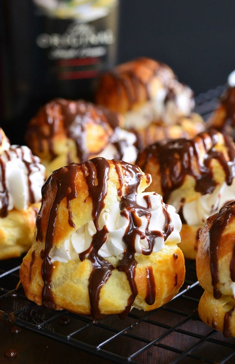 Baileys Cream Puffs. These little treats are made of fresh choux pastry, filled with Baileys whipped cream, and topped with easy Baileys chocolate sauce.