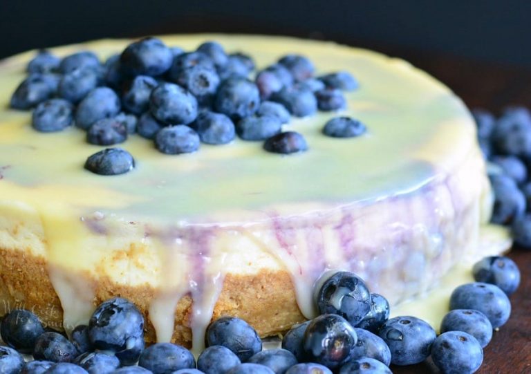 horizonal photo of white chocolate blueberry cheesecake.