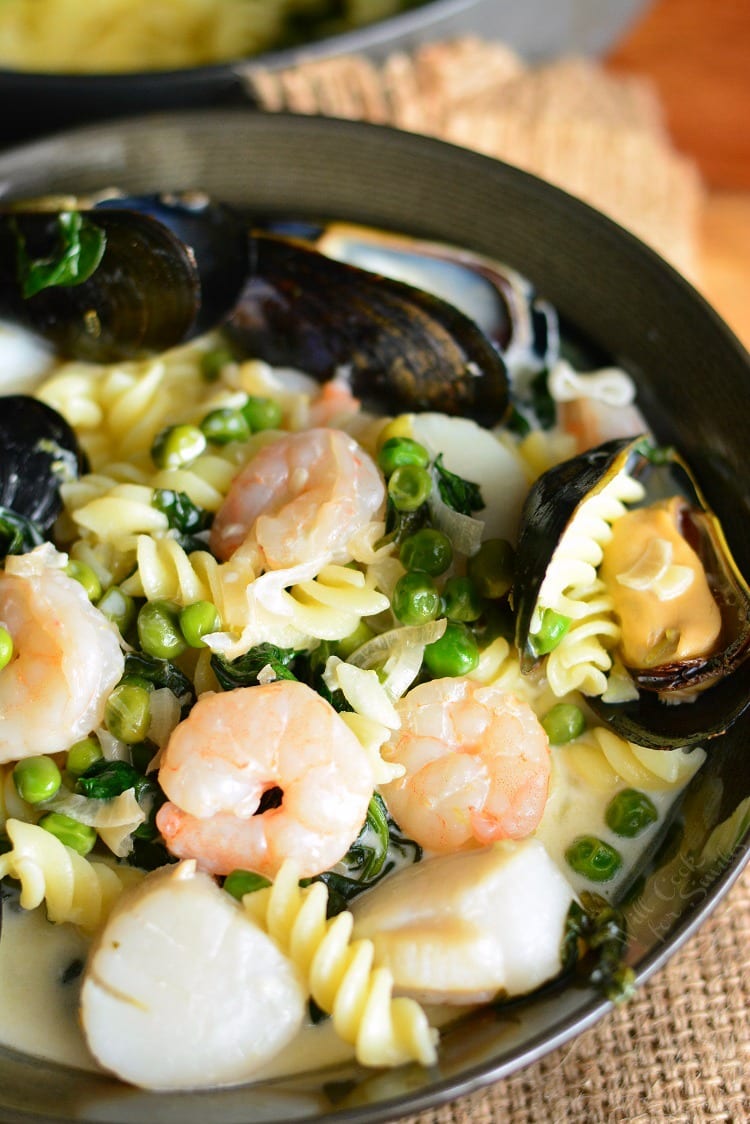 Creamy Spinach and Peas Seafood Pasta in a pan 