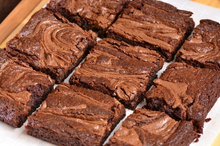 sliced up nutella brownies on parchment paper.