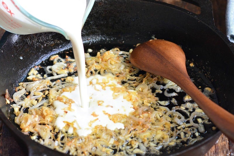 pouring heavy whipping cream into the pan