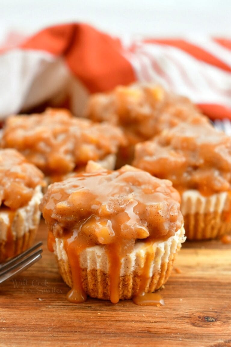 close up of caramel apple filling on mini cheesecakes