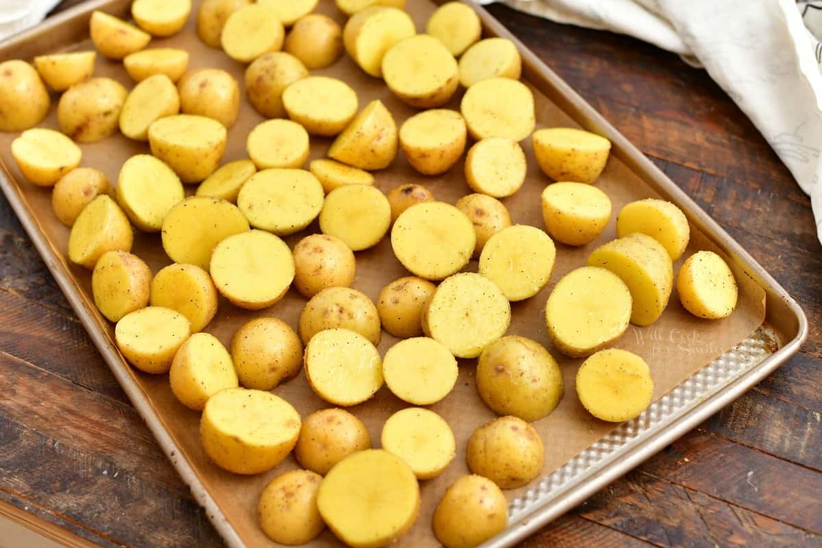 yellow potatoes on baking sheet, ready for roasting