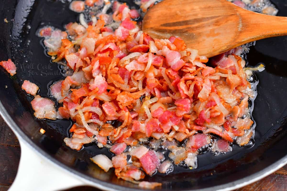 Vegetables are prepared and sautéd in a skillet.