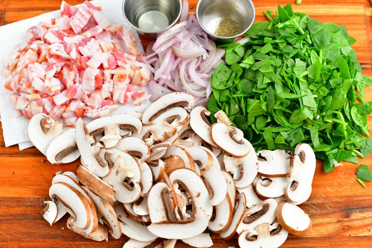 The ingredients for the quiche are placed on a wooden surface.