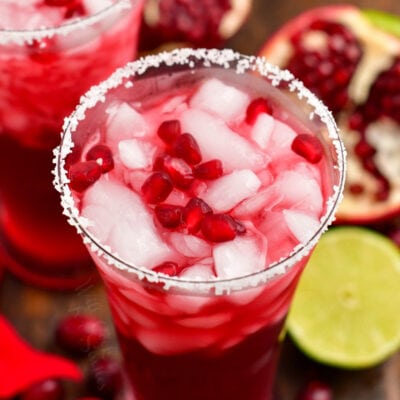 view from the top of the cocktail in the glass garnished with pomegranate seeds