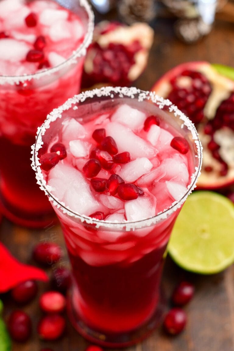 view from the top of the cocktail in the glass garnished with pomegranate seeds