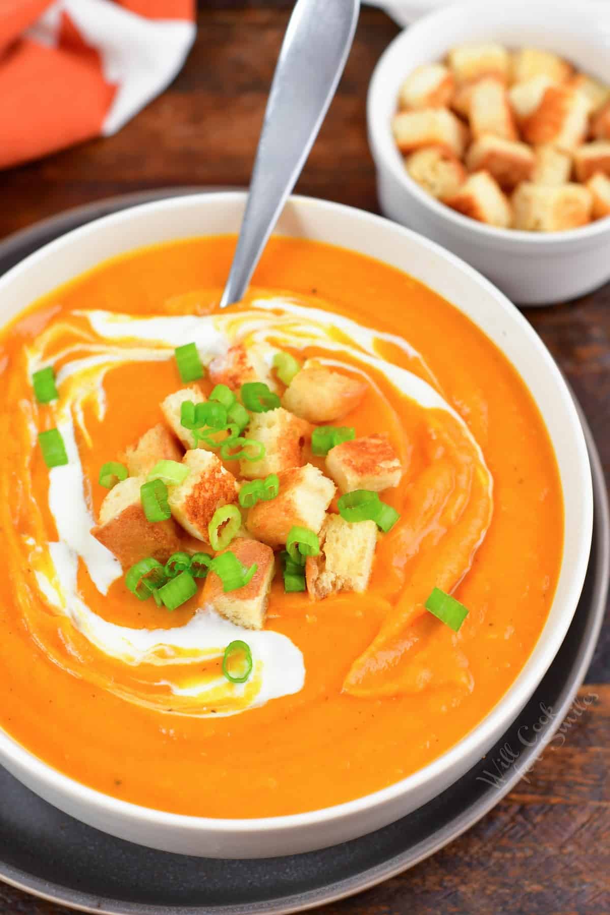 top view of sweet potato soup in a bowl with croutons