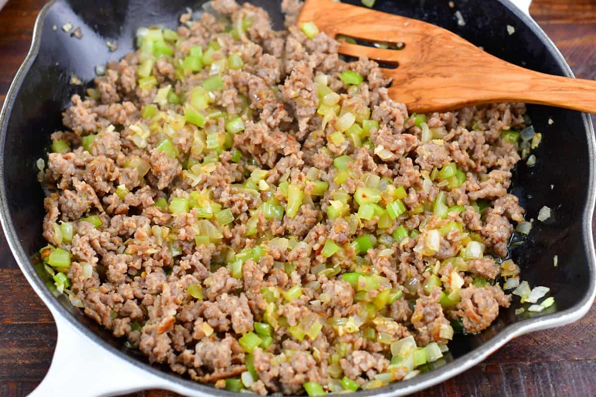 ground sausage and veggies in a cooking pan