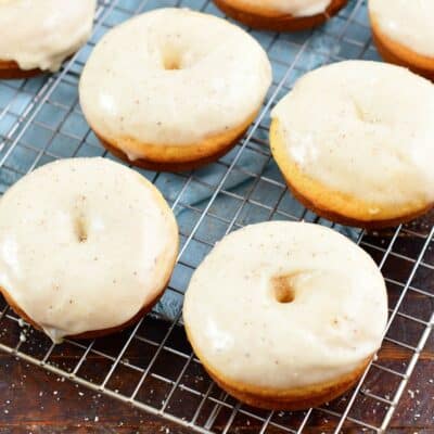 glazed doughnuts cooking on wire rack