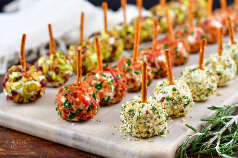 closeup of mini cheeseballs on the cutting board