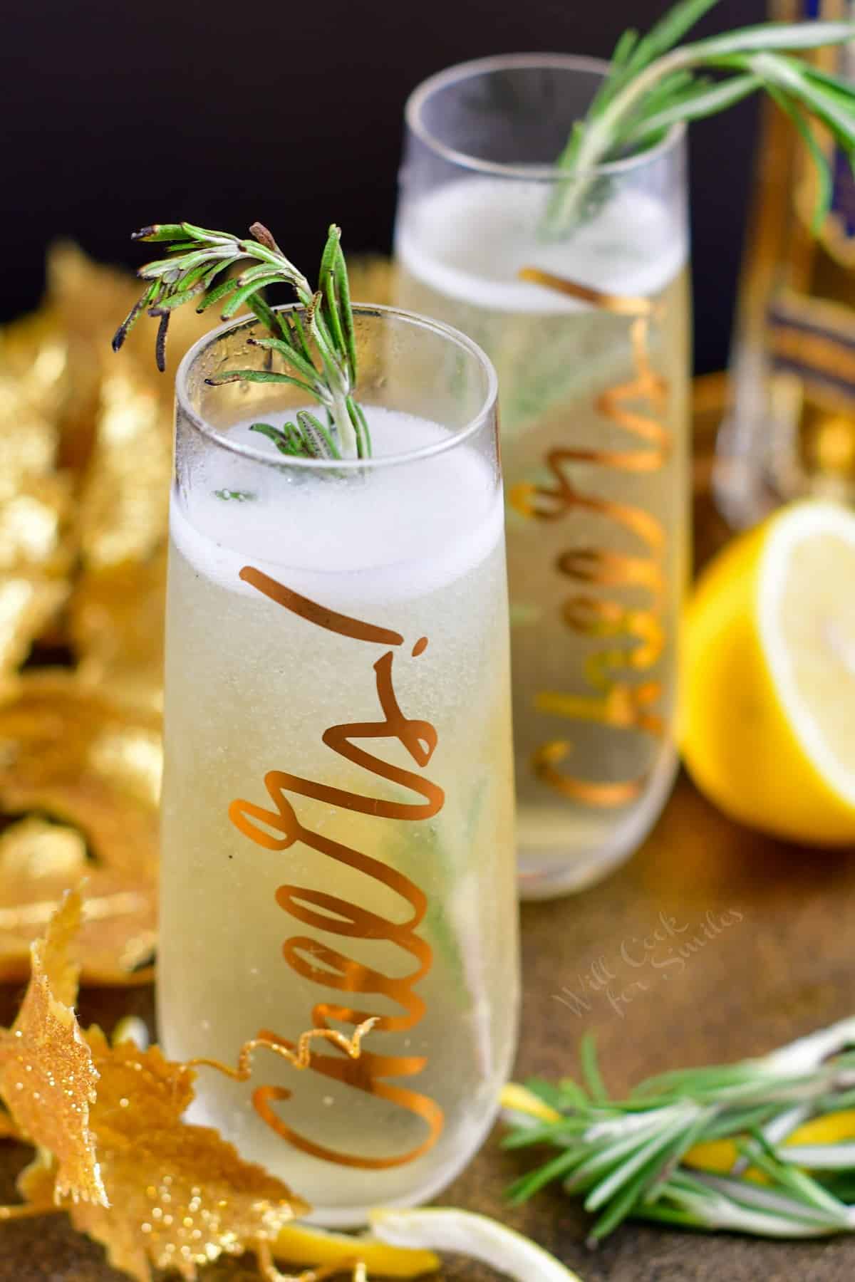 top view of champagne cocktails in tall glasses with rosemary