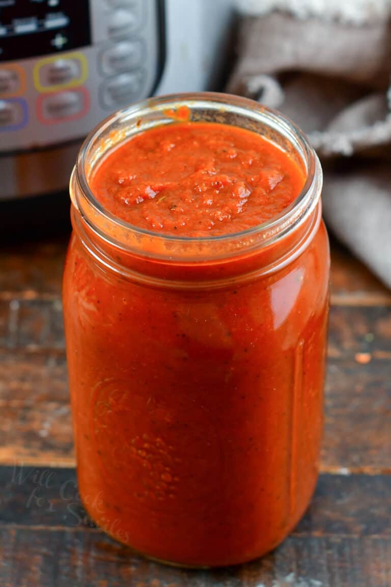 pasta sauce in a glass jar next to Instant Pot