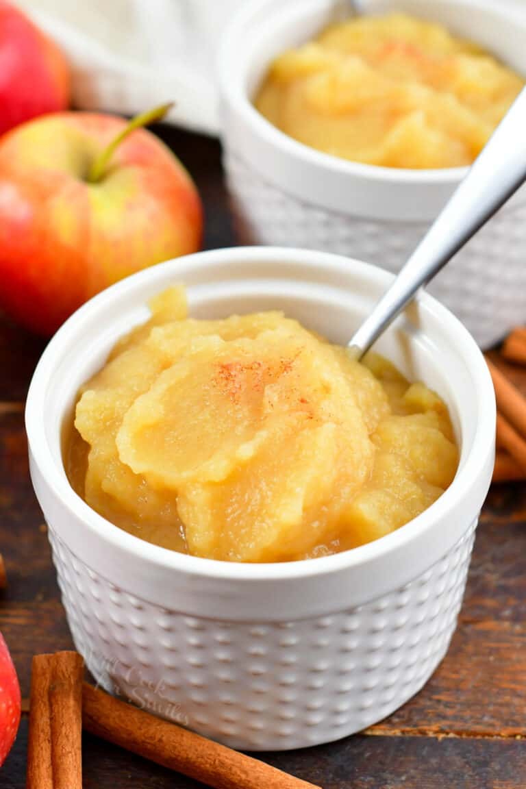 applesauce in a white cup with a spoon