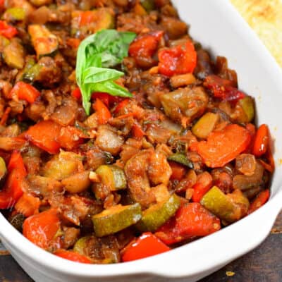 cropped square image of ratatouille in a serving dish