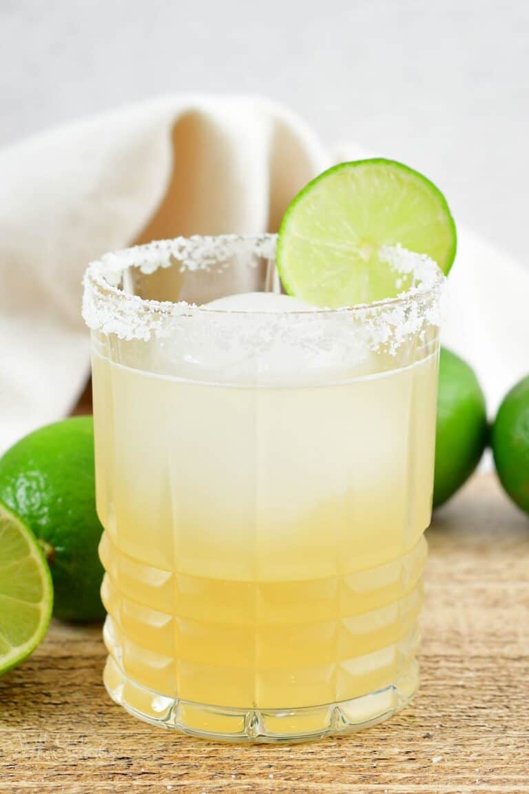 margarita cocktail in a rocks glass with salt and lime