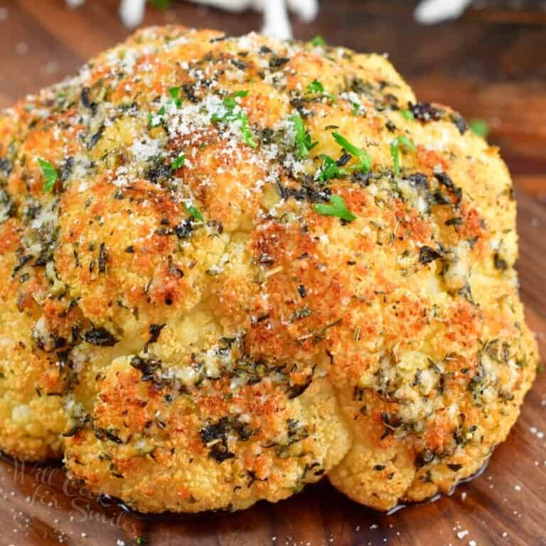 closeup of seasoned, roasted whole cauliflower head