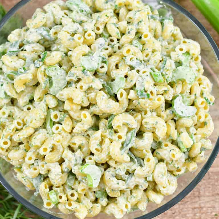 squared close up image of green macaroni salad