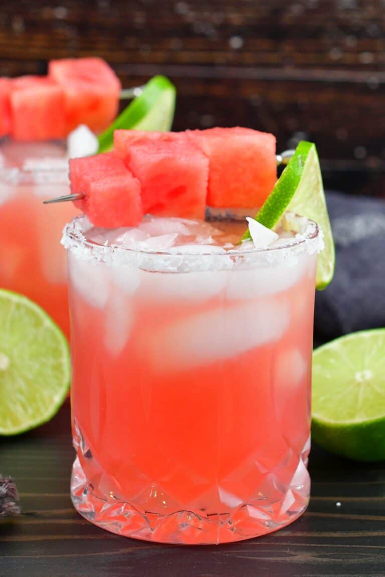 closeup watermelon margarita in a glass with salt