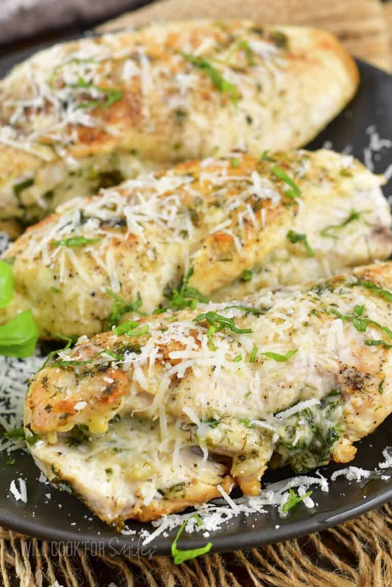 closeup of stuffed chicken breasts with parmesan.