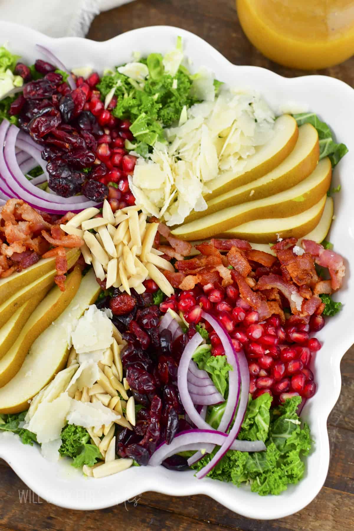 closeup top view of layered toppings on thanksgiving salad.