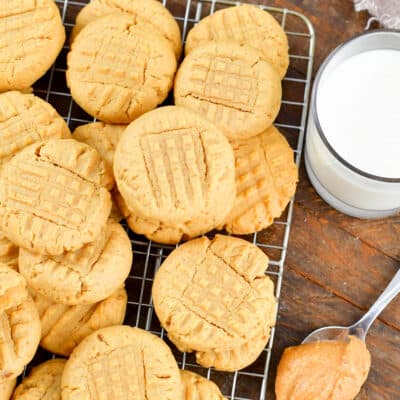 squared closeup of peanut butter cookies and milk.