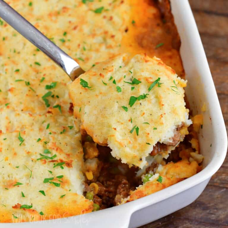 closeup of scooping some shepherd's pie out of the dish.