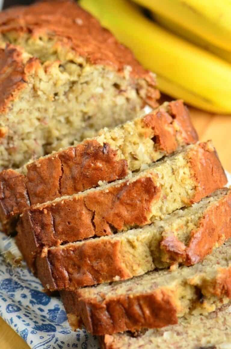 Sliced coconut banana bread on a tea towel.