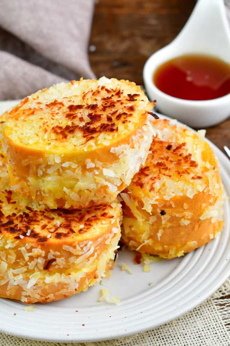 Stuffed French toast slices stacked on top of each other on a plate.