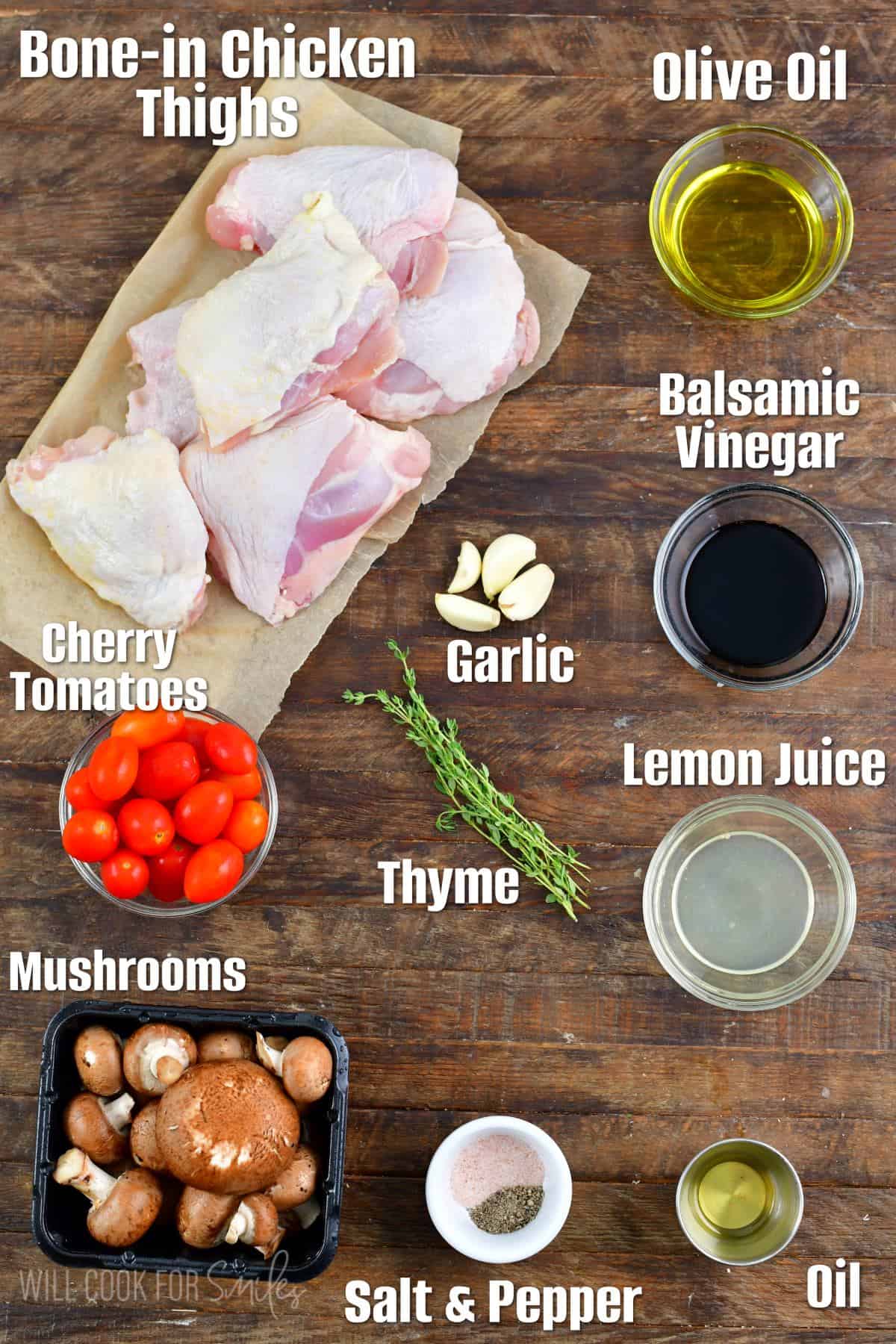 Labeled ingredients for balsamic baked chicken thighs on a wood surface.
