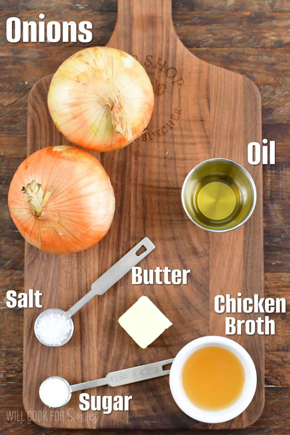 labeled ingredients to make caramelized onions on a wooden cutting board.