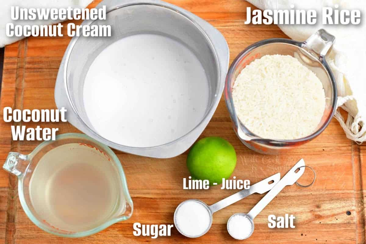 labeled ingredients to make coconut rice on a wooden cutting board.