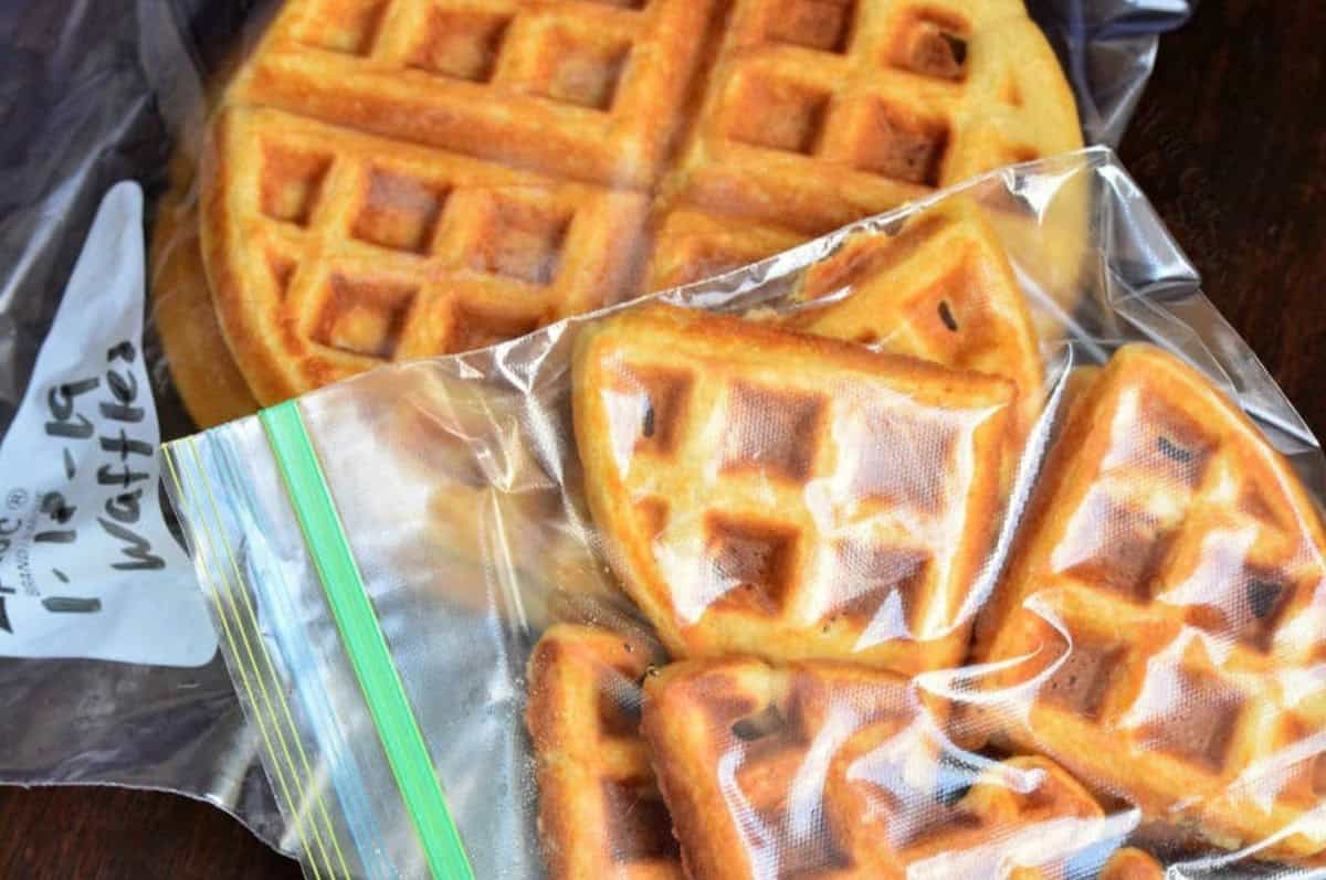 Waffles cut and put in a freezer bag and a whole waffle in a freezer bag.