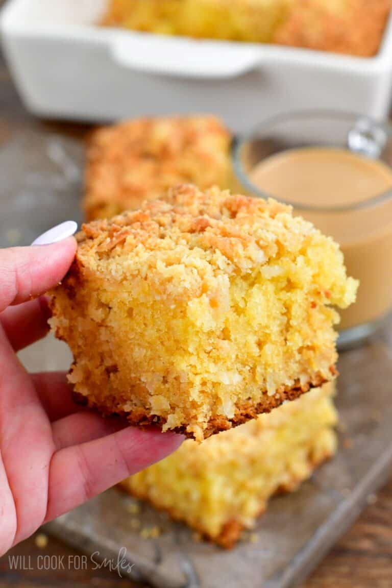 Holding a slice of coconut coffee cake in my hand.