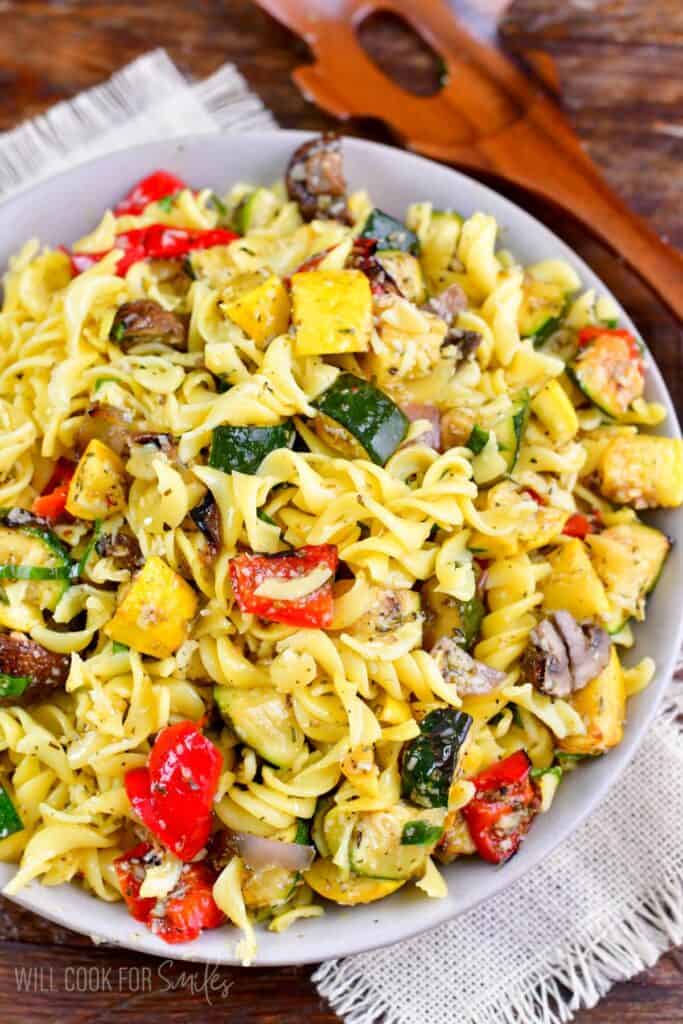 pasta salad with grilled veggies in a bowl.