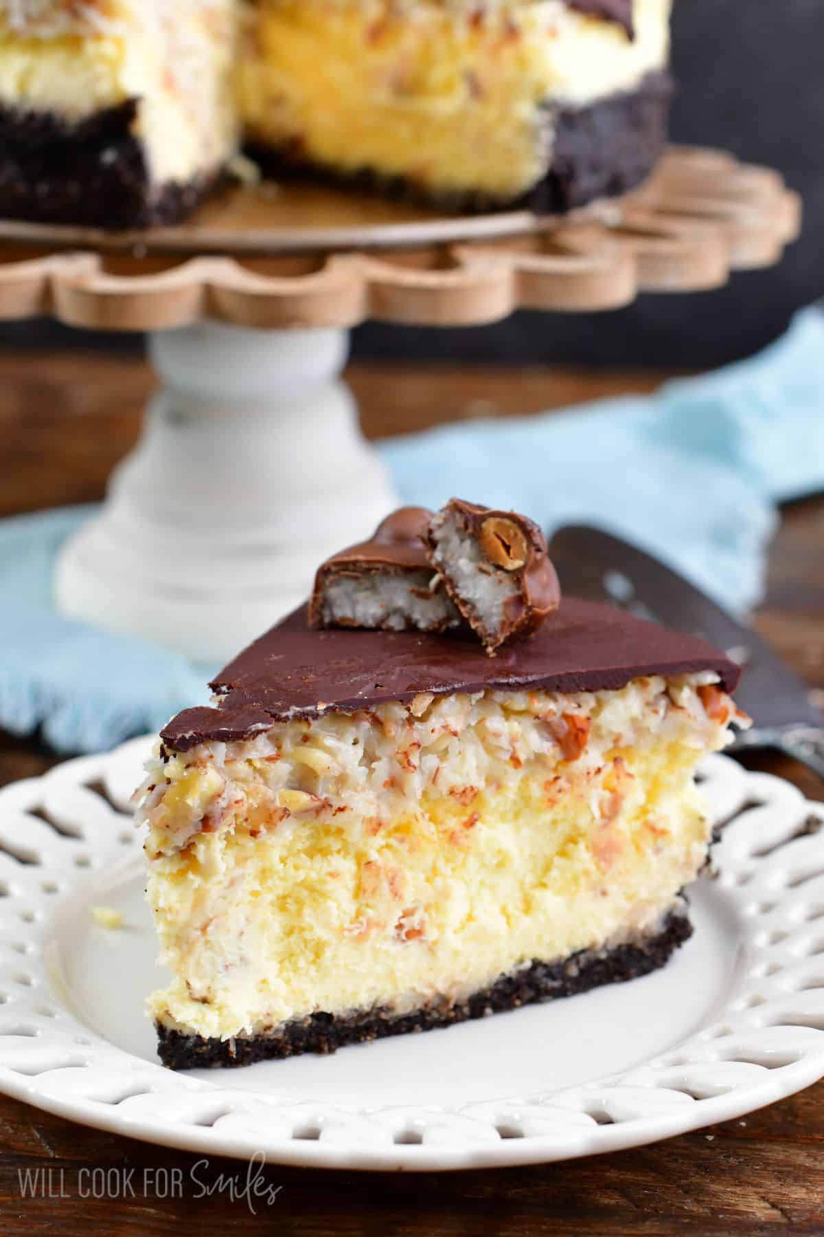 A slice of almond joy cheesecake on a plate.