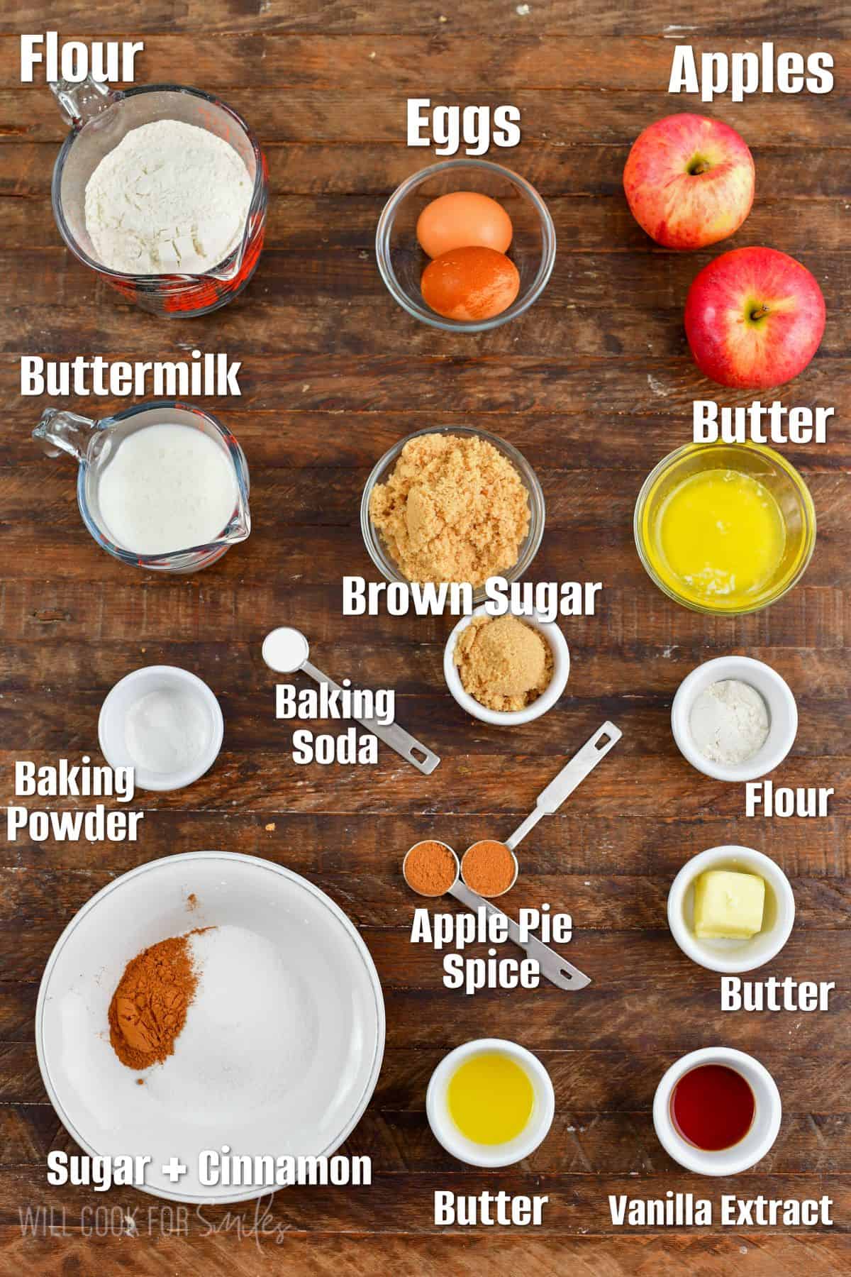 Labeled ingredients for apple donuts on wooden board.