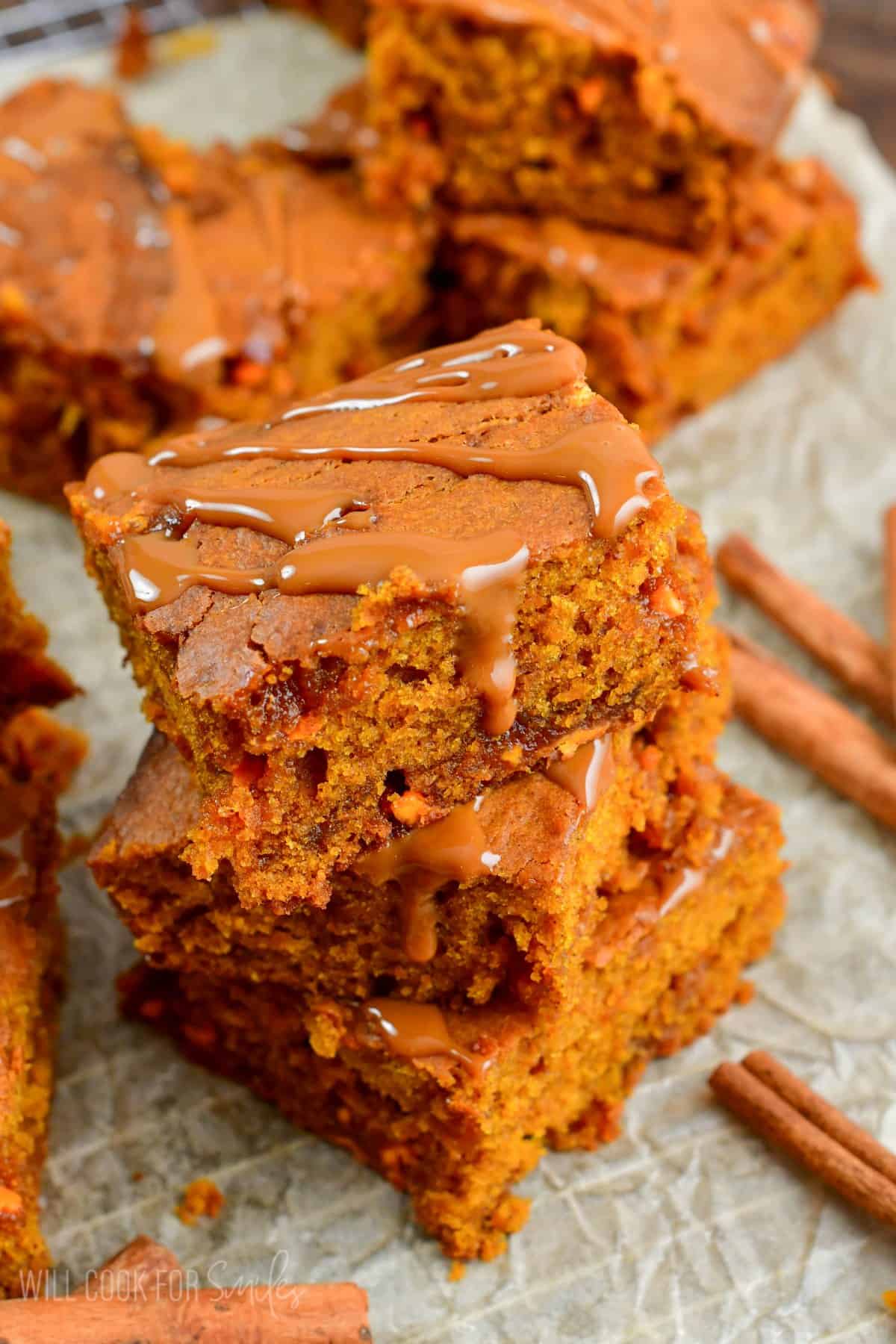 stack of three caramel pumpkin brownies stacked on top.