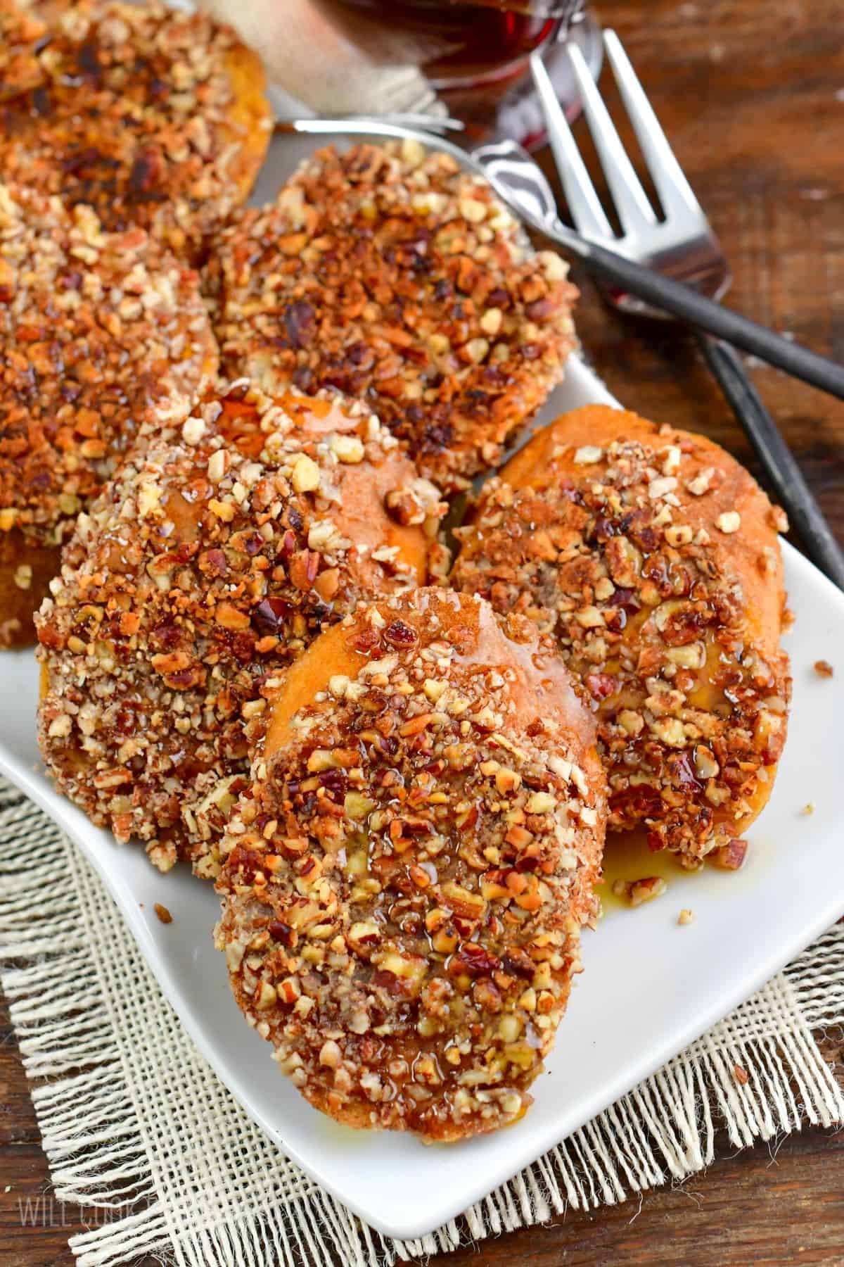 Pecan Crusted French Toast stacked side by side on a plate.