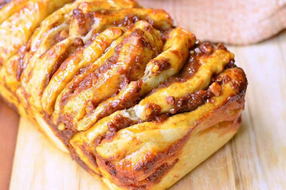 pumpkin pull apart bread with pecans and drizzled caramel on top/