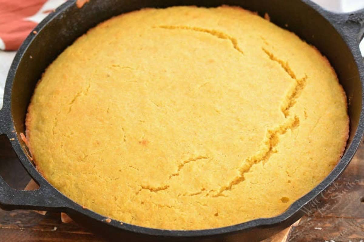 cooked cornbread in a cast iron skillet.